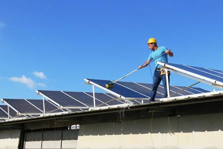 worker and solar panels worker and solar panels